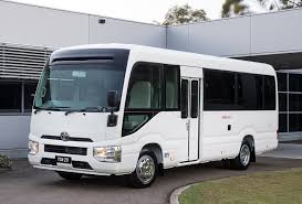 Spacious 30-seater Coaster bus available for rent in Dubai, ideal for group tours and corporate events.