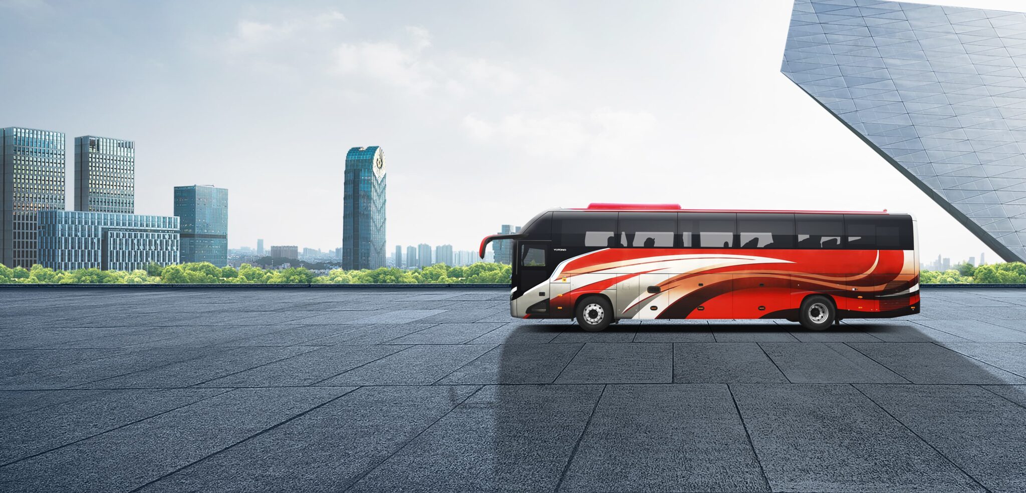 Parked bus available for self-drive in our bus rental Dubai services, positioned in a scenic urban location.